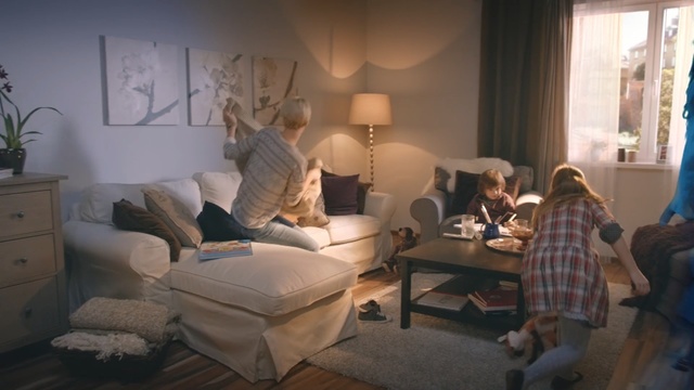 Video Reference: living room, room, furniture, interior design, home, couch, window, table, chair, house, Person