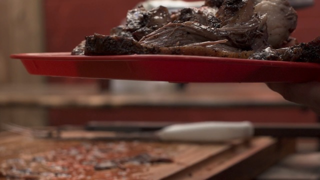 Video Reference: Food, Dish, Cuisine, Chocolate brownie, Table, Chocolate, Recipe, Indoor, Tray, Sitting, Meat, Plate, Bowl, Counter, Filled, Pizza, Red, Wooden, Cake, Cheese, Sandwich, Cutting, Toppings, Cooking, Kitchen, Broccoli, White, Cooked