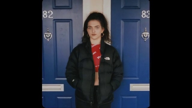Video Reference: Blue, Electric blue, Standing, Outerwear, Jacket, Shoulder, Snapshot, Blazer, Formal wear, Sleeve