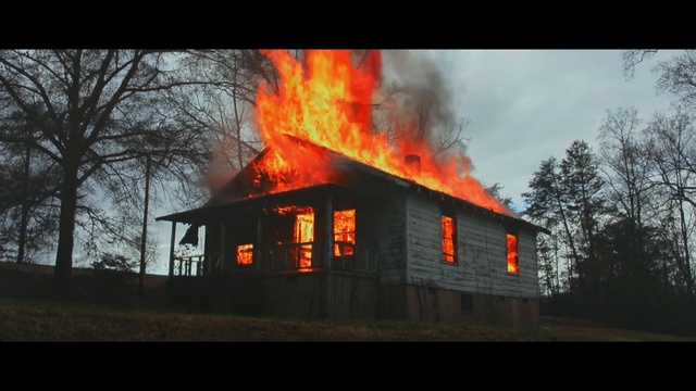 Video Reference: fire, home, house, heat, sky, geological phenomenon, campfire, wildfire, tree, evening, Person