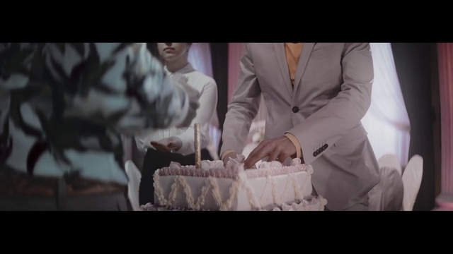 Video Reference: Photograph, Snapshot, Lady, Human, Photography, Fun, Gentleman, Hand, Suit, Dress, Person, Cake, Indoor, Man, Woman, Table, Wedding, Cutting, Photo, Posing, Holding, Standing, Knife, Cut, Sitting, Wearing, White, Large, Young, Birthday cake, Wedding cake, Wedding dress, Dessert, Candle, Bride
