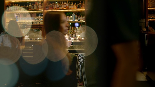 Video Reference: Bar, Alcohol, Drink, Glass bottle, Distilled beverage, Drinkware, Alcoholic beverage, Bottle, Restaurant, Stemware