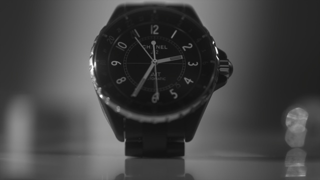 Video Reference: watch, black, black and white, photography, close up, watch accessory, monochrome photography, monochrome, watch strap, product, Person