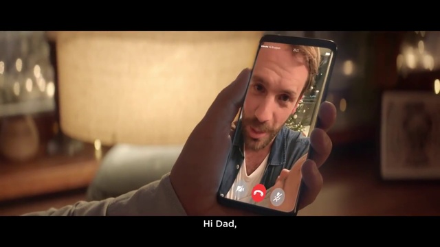 Video Reference: Screenshot, Mouth, Photography, Photo caption, Hand, Selfie, Person, Indoor, Looking, Sitting, Woman, Photo, Holding, Table, Front, Using, Head, Food, Young, Screen, Face, Man, Orange, Girl, Smiling, Large, Phone, Red, White, Human face, Text