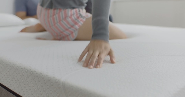 Video Reference: floor, hand, furniture, flooring, textile, table, bed, wood, mattress, finger