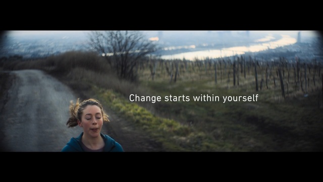 Video Reference: Nature, Photograph, Wilderness, Natural environment, Atmospheric phenomenon, Tree, Sky, Light, Forest, Morning, Person, Photo, Man, Holding, Looking, Front, Smiling, Woman, Young, Camera, Standing, Red, Riding, Orange, Flying, Wearing, Board, Air, Water, Human face, Smile, Screenshot, Text, Clothing, Girl