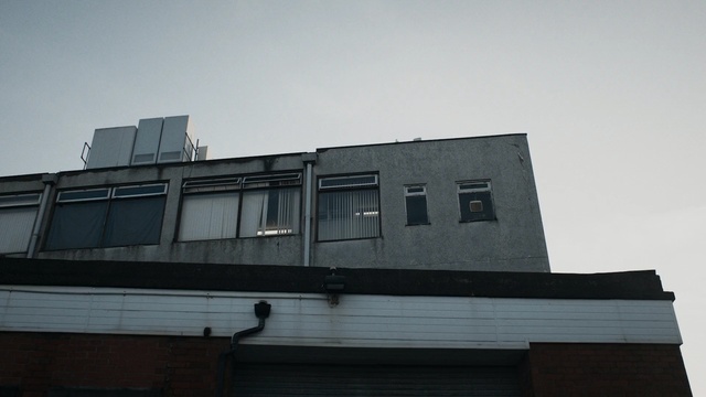 Video Reference: Architecture, Daytime, Sky, Building, Urban area, Wall, Line, House, Facade, Material property, Person