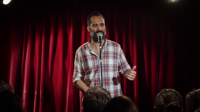 Video Reference: Facial hair, Performance, Red, Stage, Beard, Singing, Event, Talent show, Performing arts, Design