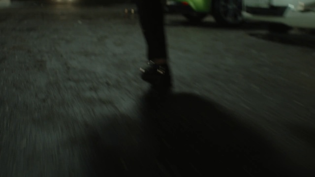 Video Reference: Black, Green, Darkness, Floor, Light, Footwear, Flooring, Night, Snapshot, Asphalt