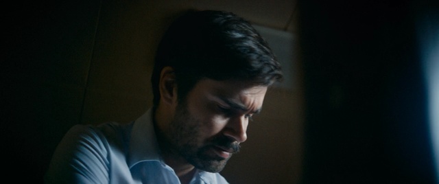 Video Reference: Face, Head, Chin, Forehead, Facial hair, Nose, Human, Beard, Darkness, Mouth, Person, Man, Indoor, Looking, Laptop, Computer, Front, Shirt, Standing, Sitting, Young, Using, Screen, Holding, Table, Food, Room, Desk, People, White, Video, Phone, Human face, Screenshot, Portrait, Dark, Clothing, Human beard, Eyes