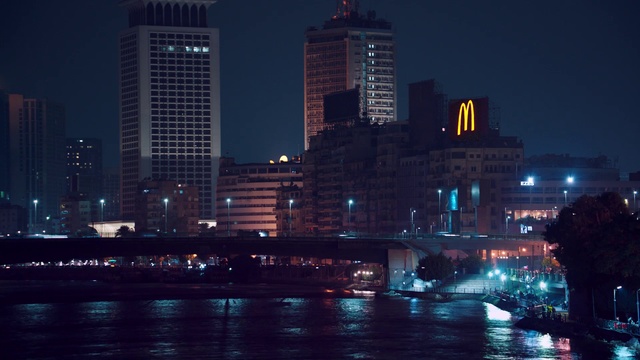 Video Reference: City, Metropolitan area, Night, Cityscape, Metropolis, Urban area, Human settlement, Skyline, Water, Sky, Person