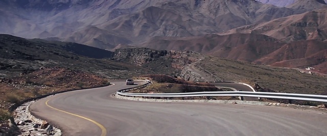 Video Reference: Mountainous landforms, Mountain pass, Road, Asphalt, Valley, Wadi, Infrastructure, Mountain, Geological phenomenon, Highway
