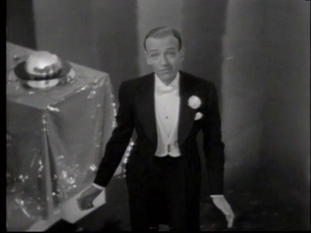 Video Reference: Suit trousers, Coat, Sleeve, Flash photography, Dress shirt, Collar, Blazer, Formal wear, Suit, Event