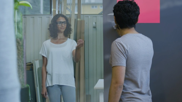 Video Reference: standing, shoulder, snapshot, girl, t shirt, window, fun, conversation, communication, Person