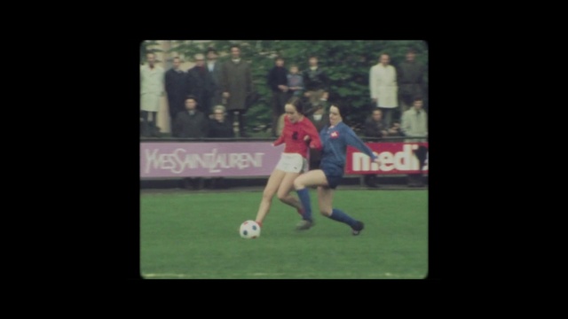 Video Reference: Football player, Player, Sports, Team sport, Ball game, Grass, Competition event, Tournament, Soccer, Sports equipment