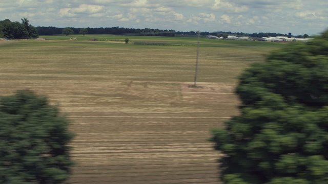 Video Reference: Land lot, Field, Plain, Natural environment, Rural area, Sky, Grass, Farm, Grass family, Tree