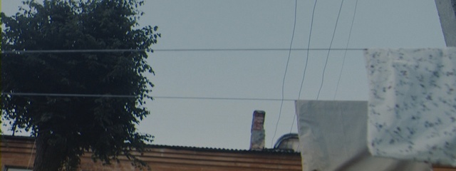 Video Reference: sky, wall, architecture, urban area, residential area, tree, building, house, roof, daytime