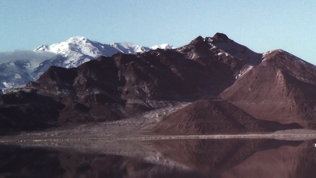 Video Reference: mountainous landforms, mountain, ridge, mountain range, badlands, highland, sky, geological phenomenon, plateau, massif