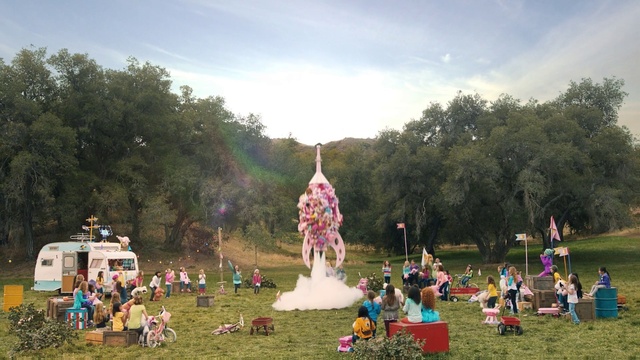 Video Reference: Pole, Grass, Tree, Fun, Leisure, Event, Recreation, Plant, Hill station, Tourist attraction