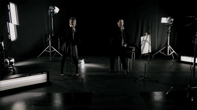 Video Reference: black, stage, darkness, performance, musical instrument accessory, lighting, performance art, black and white, scene, sound, Person