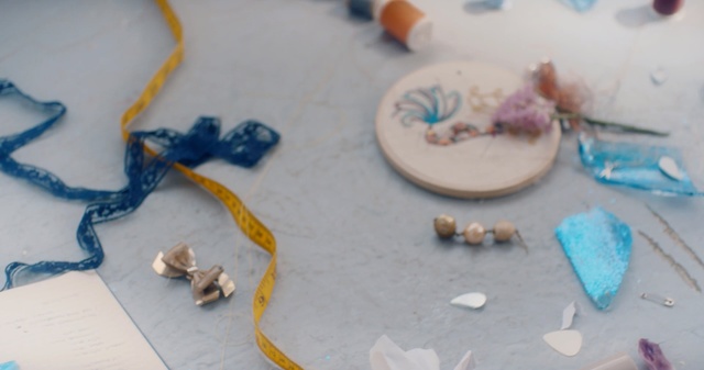 Video Reference: Blue, Play, Art, Cake, Table, Indoor, Chocolate, Sitting, Birthday, Small, Plate, Piece, Decorated, White, Topped, Little, Food, Holding, Laying, Board, Man, Tool