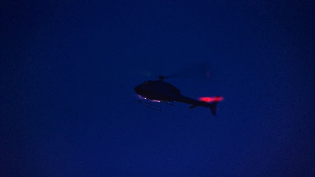 Video Reference: Blue, Red, Sky, Helicopter, Rotorcraft, Air travel, Helicopter rotor, Aviation, Vehicle, Flight, Outdoor, Flying, Transport, Aircraft, Airplane, Plane, Jet, Large, Dark, Air, High, Night, Passenger, Light, Commercial, Skiing, Cloudy, Clear, White, Day