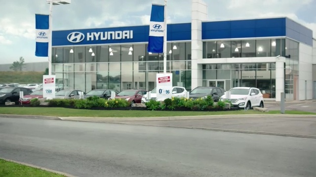 Video Reference: Building, Car dealership, Vehicle, Real estate, Car, Company, Signage, Commercial building, Person