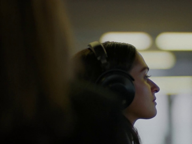 Video Reference: Hair, Face, Audio equipment, Head, Hairstyle, Cheek, Ear, Forehead, Human, Eye