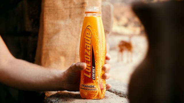 Video Reference: drink, distilled beverage, liqueur, bottle, Person