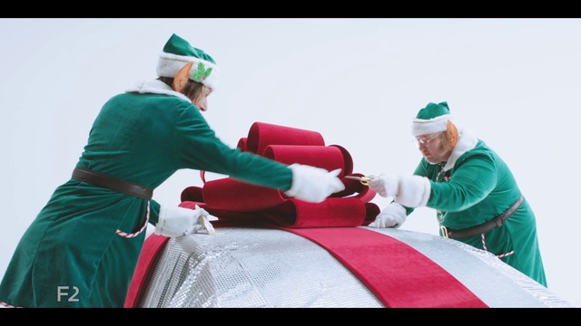 Video Reference: Sleeve, Gesture, Glove, Hat, Cap, Recreation, Event, Holiday, Santa claus, Lap