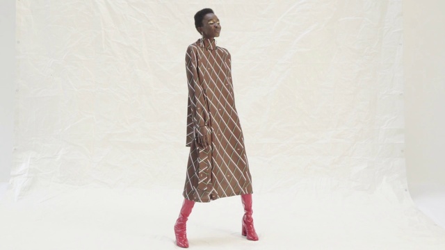 Video Reference: Clothing, White, Dress, Neck, Fashion, Fashion design, Beige, Outerwear, Formal wear, Textile