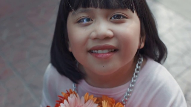 Video Reference: Face, Hair, Child, Facial expression, Skin, Smile, Cheek, Nose, Tooth, Head