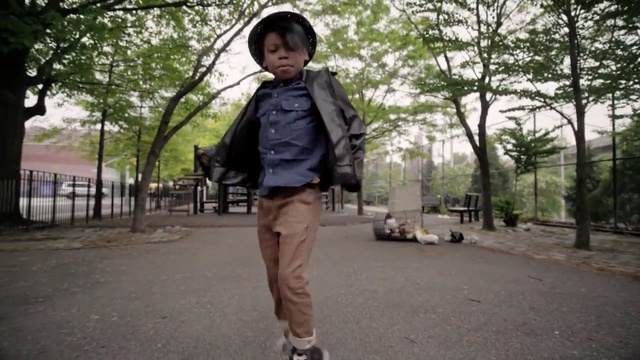 Video Reference: clothing, footwear, road, infrastructure, jacket, snapshot, street, outerwear, jeans, fashion