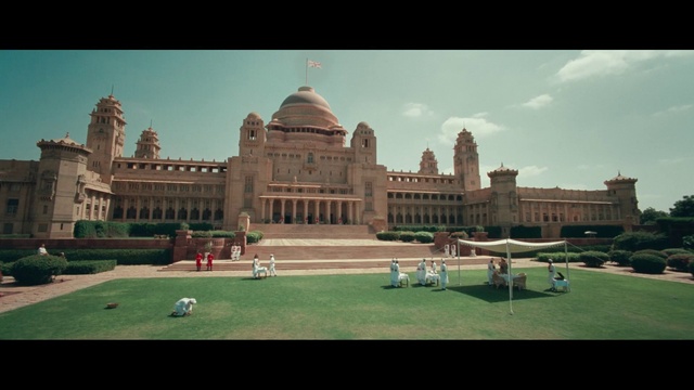 Video Reference: Sky, Cloud, Grass, Building, Landscape, City, Facade, Lawn, Urban design, Sports equipment