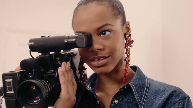 Video Reference: Camera operator, Hairstyle, Photographer, Cameras & optics, Photography, Cinematographer, Videographer, Single-lens reflex camera, Camera, Camera accessory