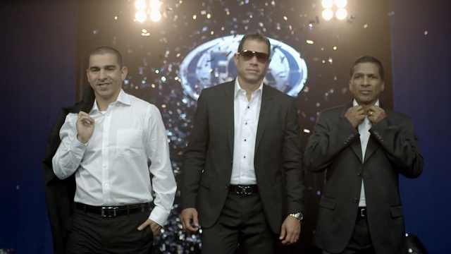 Video Reference: suit, gentleman, official, formal wear, event, product, tuxedo, Person