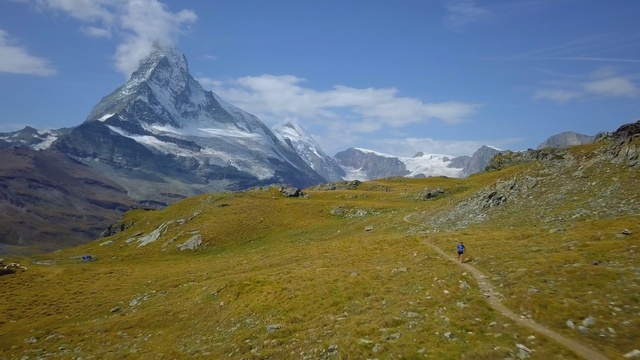 Video Reference: mountainous landforms, mountain range, mountain, wilderness, ridge, highland, mount scenery, sky, mountain pass, fell