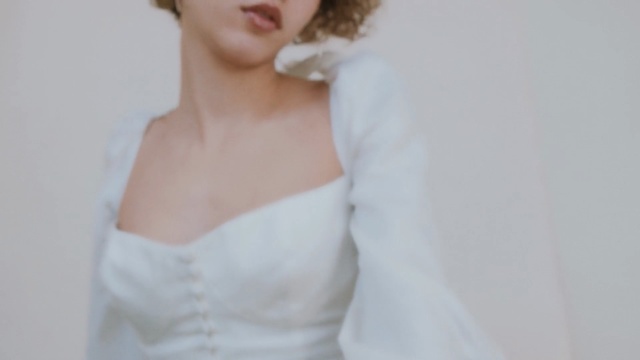 Video Reference: gown, photograph, bride, bridal clothing, wedding dress, dress, shoulder, bridal accessory, hairstyle, photo shoot