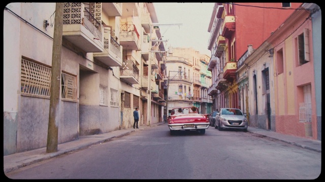 Video Reference: Neighbourhood, Street, Town, Mode of transport, Road, Vehicle, Car, Residential area, Human settlement, Urban area