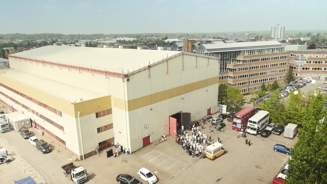 Video Reference: property, neighbourhood, residential area, roof, building, real estate, city, suburb, vehicle, Person