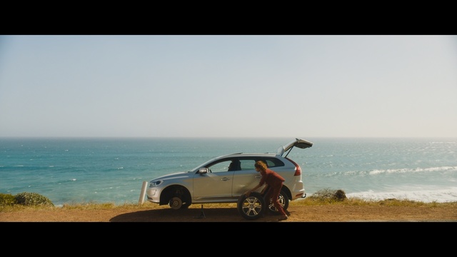 Video Reference: car, sky, automotive design, sea, vehicle, horizon, beach, coast, sand, landscape, Person