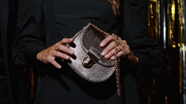 Video Reference: Hand, Fashion, Musical instrument, Fashion accessory, Photography, Leather