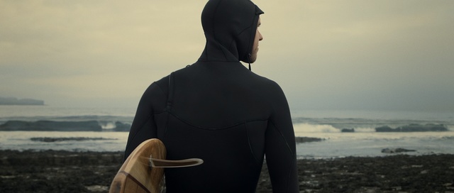 Video Reference: sky, standing, outerwear, neck, wetsuit, sea, jacket, girl, vacation, fun