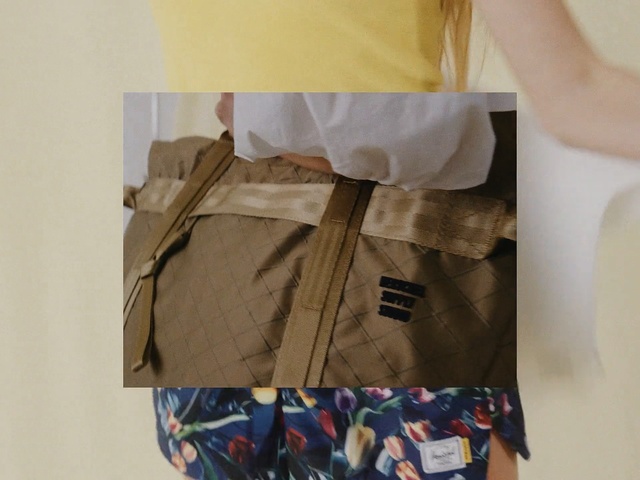 Video Reference: Yellow, Bag, Beige, Packaging and labeling, Shorts, Fashion accessory, Pattern, Paper bag, Shopping bag