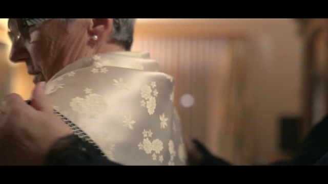 Video Reference: Dress, Gown, Photography, Lighting accessory, Lampshade, Black hair, Indoor, Cake, Table, Man, Sitting, Photo, Woman, Food, Girl, Young, Holding, Close, Shirt, White, Mirror, Wedding, Standing, Room, Eating, Red, Teeth, Wedding dress, Bride, Flower, Fashion accessory