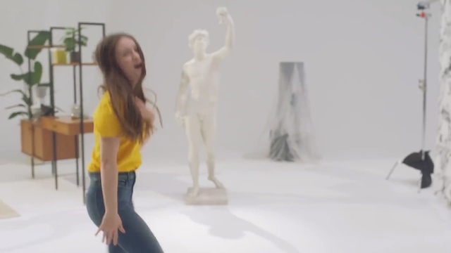 Video Reference: Yellow, Standing, Fashion, Art, Fashion design, Furniture, Interior design, Visual arts, Floor, Performance art
