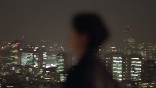 Video Reference: night, cityscape, city, metropolis, urban area, skyline, skyscraper, darkness, metropolitan area, light, Person