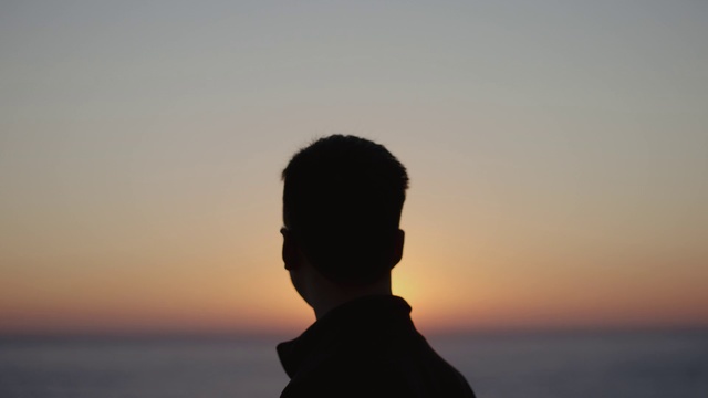 Video Reference: Sky, Horizon, Sea, Backlighting, Silhouette, Ocean, Sunset, Calm, Human, Photography