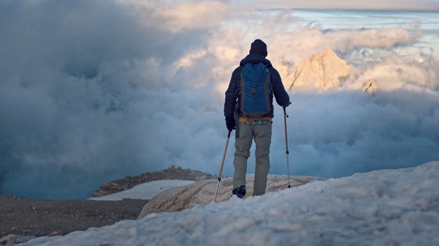 Video Reference: Mountainous landforms, Mountain, Mountaineer, Mountaineering, Snow, Ridge, Geological phenomenon, Winter, Sky, Adventure, Person