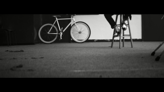 Video Reference: bicycle, white, road bicycle, black, black and white, photograph, monochrome photography, darkness, mode of transport, photography